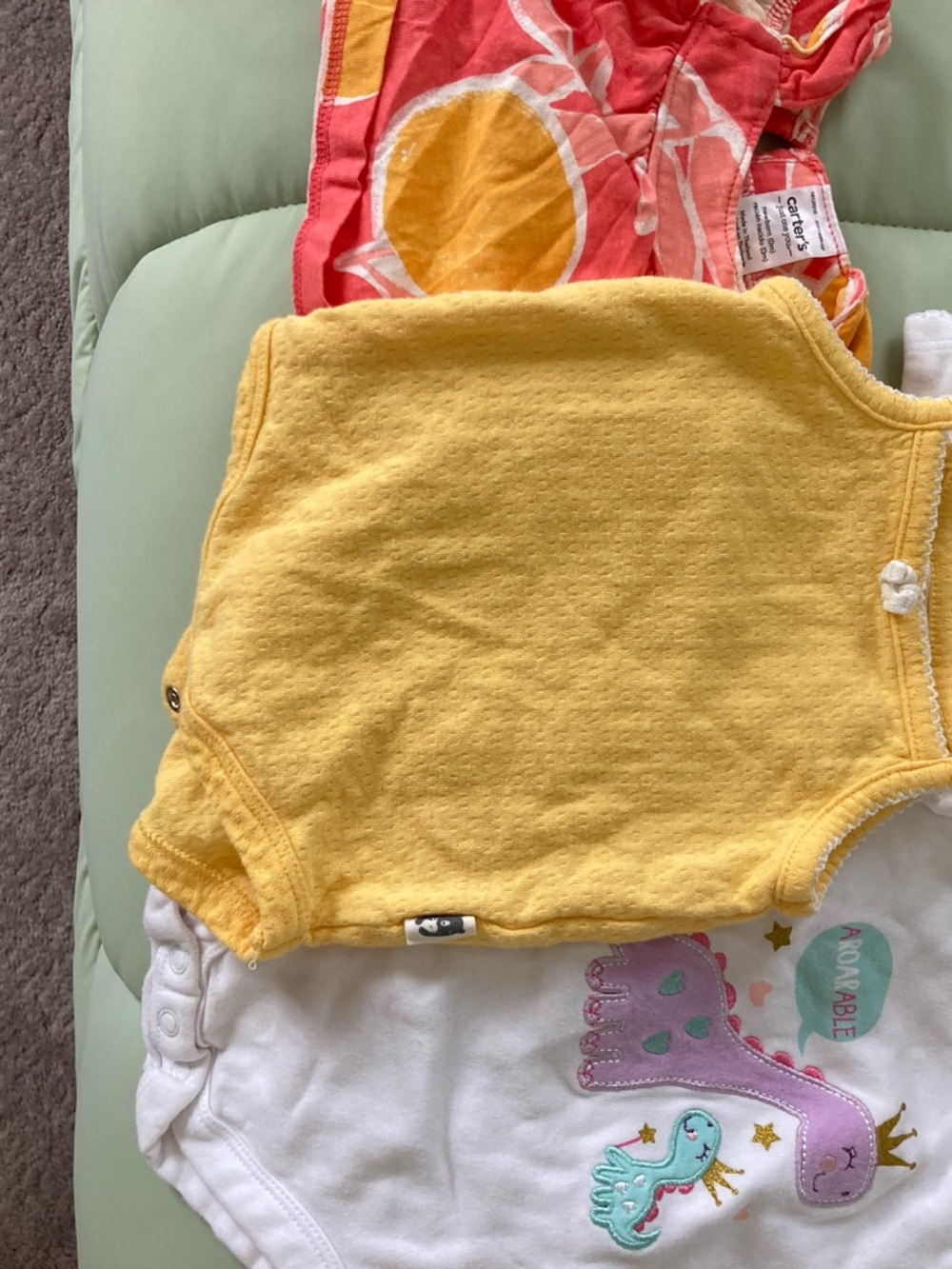 Bundle of baby onesies and tops